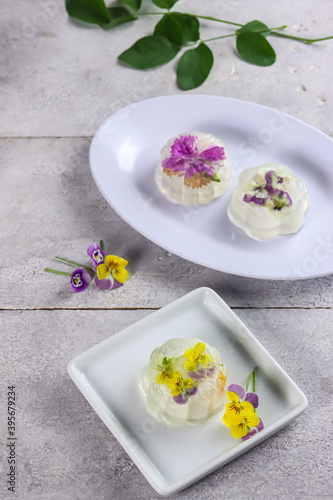 Puding mooncake or pudding jelly mooncake with edible flowers.