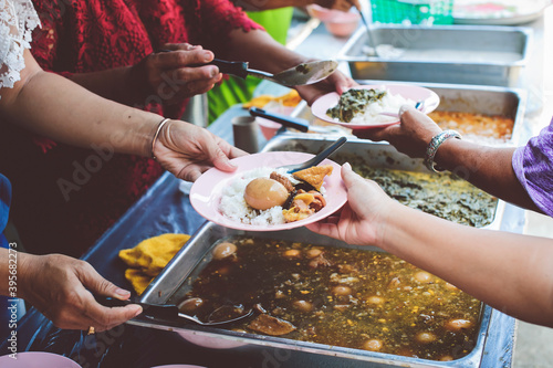 Free food for poor and homeless: Concept serving free food to the poor