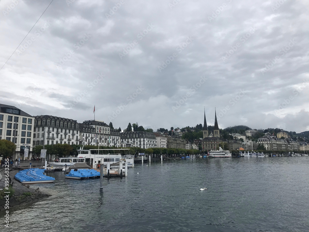 lake view with Church of St. Leodegar or Hofkirche St. Leodegar in Lucerne city, Switzerland lake view with Church of St. Leodegar or Hofkirche St. Leodegar in Lucerne city, Switzerland