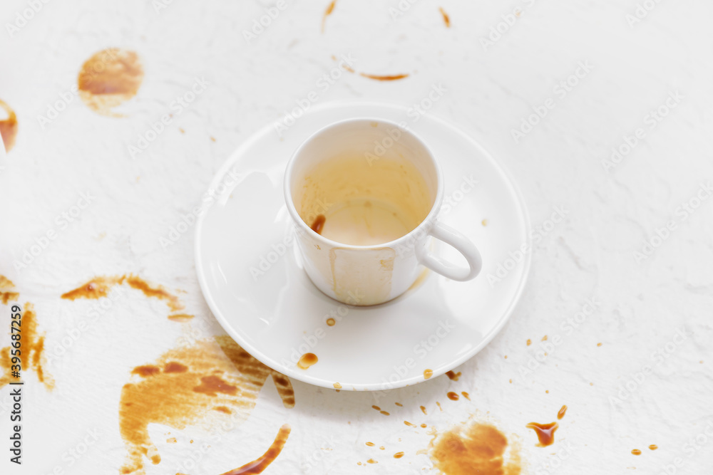 Cup and coffee stain on light background Cup and coffee stain on light background