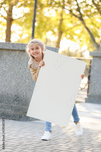Cute little girl with blank...