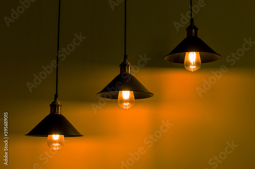 Fotografija Three lamps with vintage incandescent bulbs with warm light