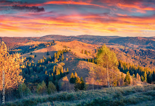 Spectacular morning view of outskirts of popular tourist resort - Yaremche. Incredible runrise in Carpathian mountains. Stunning  autumn landscape. Beauty of nature concept background. photo