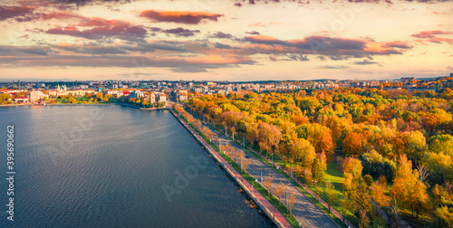 Aerial landscape photography. Colorful autumn cityscape of Ternopil town, Ukraine, Europe. Splendid morning view from flying drone of Ternopil lake. Beautiful autumn scenery.