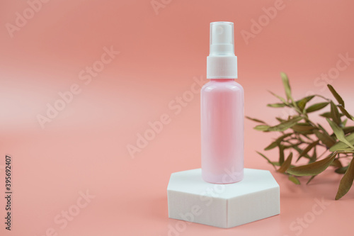 Pink cosmetic bottles for cream, gel, lotion. Skincare cosmetic concept.