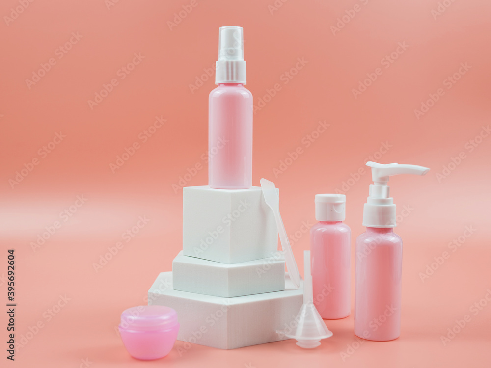 Pink cosmetic bottles for cream, gel, lotion. Skincare cosmetic concept. Pink cosmetic bottles for cream, gel, lotion. Skincare cosmetic concept.