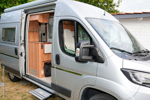 Motorhome grey RV campervan parked open door for night