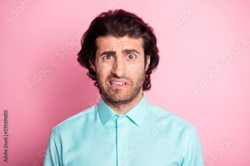 Photo of young multiethnic man amazed impressed frown shocked fake news isolated over pink color background