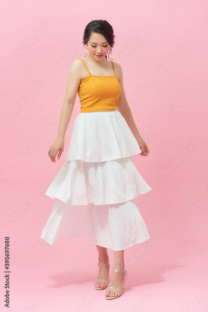 Magnificent woman in long white skirt dancing with sincere smile. Magnificent woman in long white skirt dancing with sincere smile.