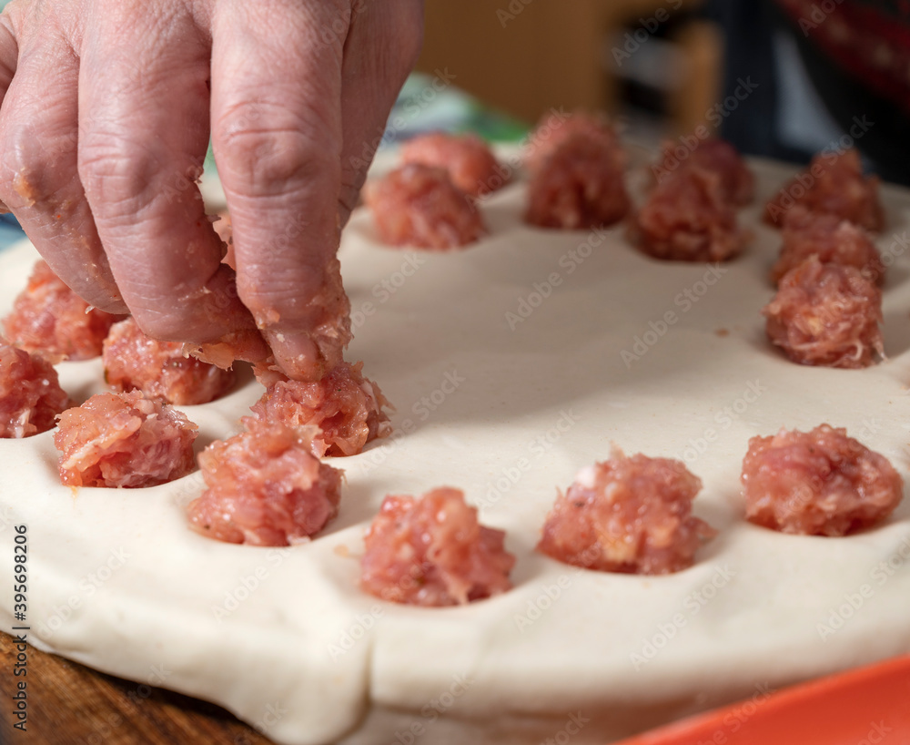 Woman cooking delicious homemade dumplings on the kitchen Woman cooking delicious homemade dumplings on the kitchen