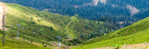 Chairlift in a mountain region in summer. Life of ski resort in summertime