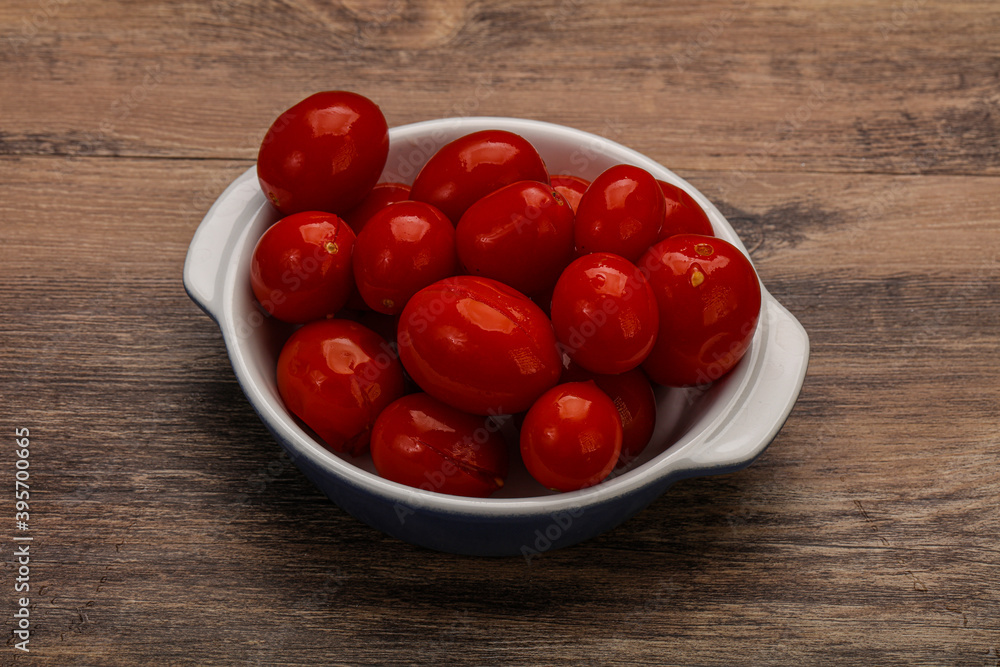 Pickled cherry tomatoes in the bowl Pickled cherry tomatoes in the bowl