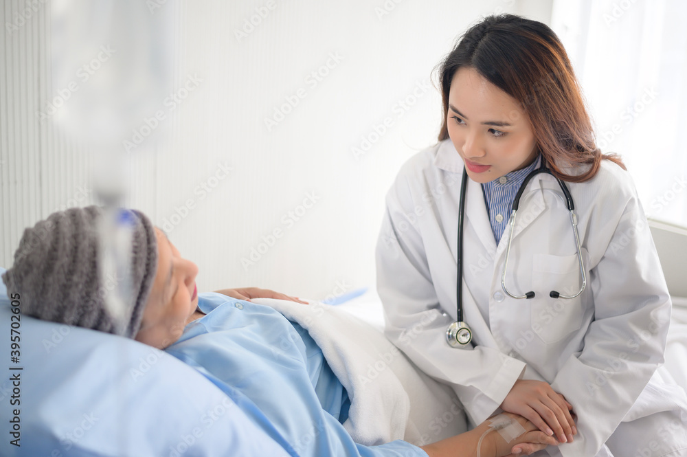 Cancer patient woman wearing head scarf after chemotherapy consulting and visiting doctor in hospital. Cancer patient woman wearing head scarf after chemotherapy consulting and visiting doctor in hospital.