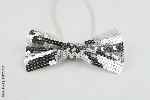 bow tie made of sequins on a white background