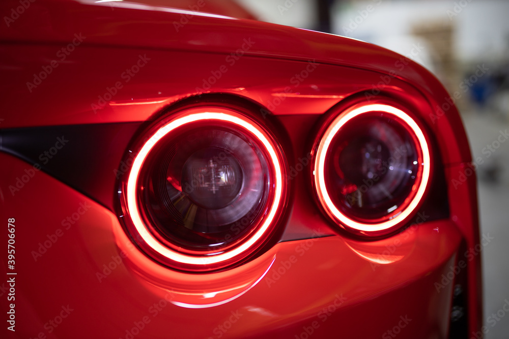 round red back lights of a luxury dream sports car