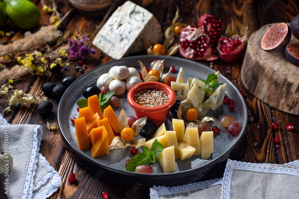 different cheese assorty on wood background