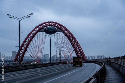red cable-stayed bridge and freeway at sunrise on winter morning © константин константи