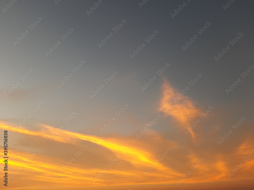 Fototapeta premium Nature's Own Painting With Streaks of Orange & Yellow Clouds