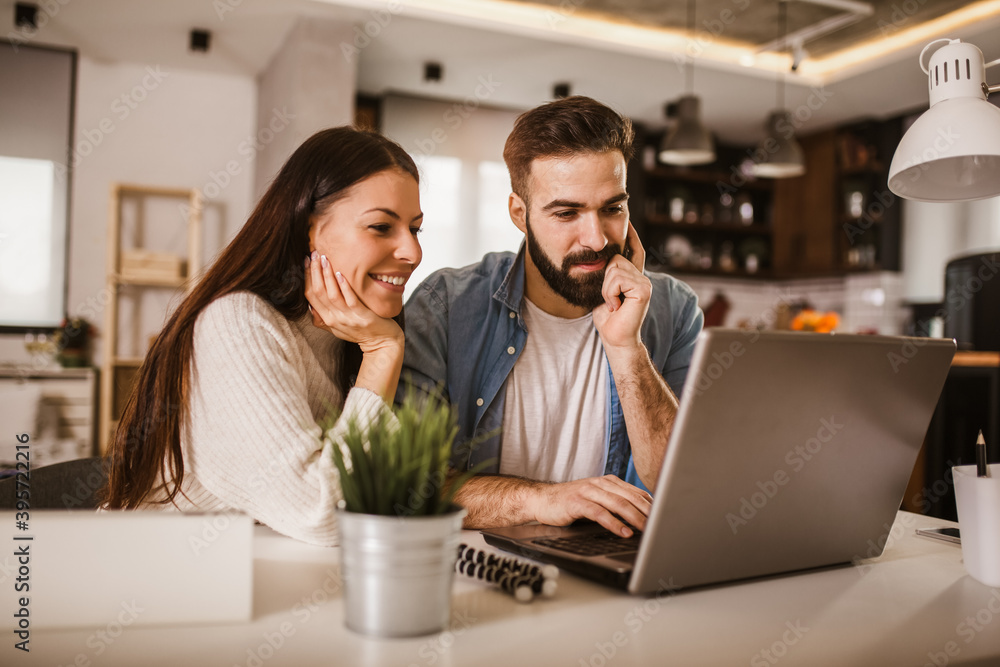 Happy couple enjoying work from home. Happy couple enjoying work from home.