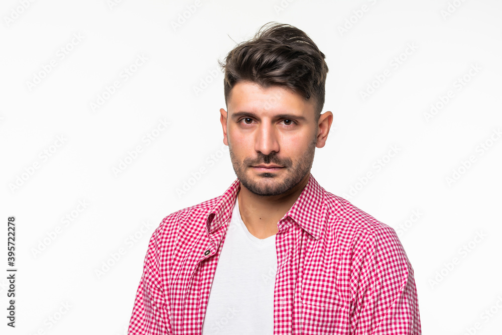 Casual young man looking at camera isolated on white background Casual young man looking at camera isolated on white background