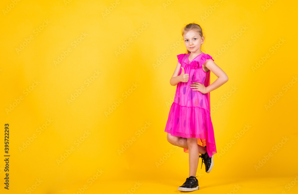 just having fun. trendy fashionable look. copy space. beautiful teen girl with thumb up gesture. kid fashion style. female natural beauty. happy childhood. cute child on yellow background just having fun. trendy fashionable look. copy space. beautiful teen girl with thumb up gesture. kid fashion style. female natural beauty. happy childhood. cute child on yellow background