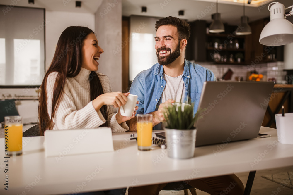 Happy couple enjoying work from home. Happy couple enjoying work from home.