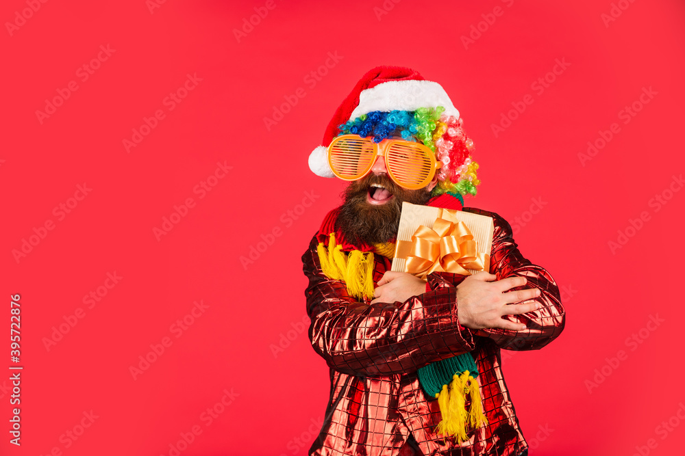 Christmas gift. Cheerful guy colorful hairstyle. Funny man with beard. Cool Specials. Winter holidays. Bearded man celebrate christmas. Christmas entertainment ideas. Wishing you peace and prosperity