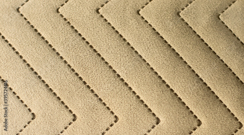 Obraz na plátne Textured textile, beige material with curves sewed lines, ornament fabric backgr