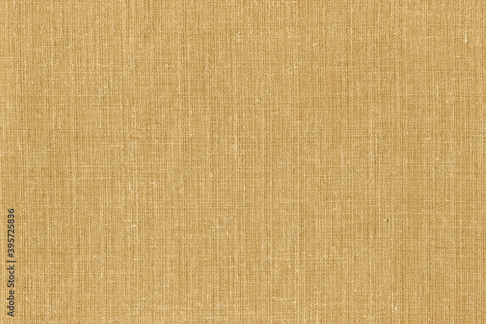 Fototapeta premium Texture of coarse natural linen fabric of natural warm color. Light brown burlap.
