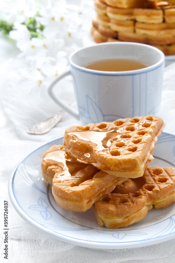 Morning breakfast with waffles in the shape of heart, homemade food