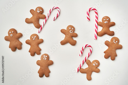 Top view of gingerbread men with candy cane
