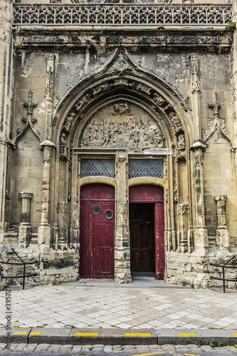 Built in heart of Fecamp XVI century Saint-Etienne church dominates now wearing Norman city: Renaissance portal, flamboyant Gothic steeple. Fecamp, Seine-Maritime department, Haute-Normandie, France. © dbrnjhrj