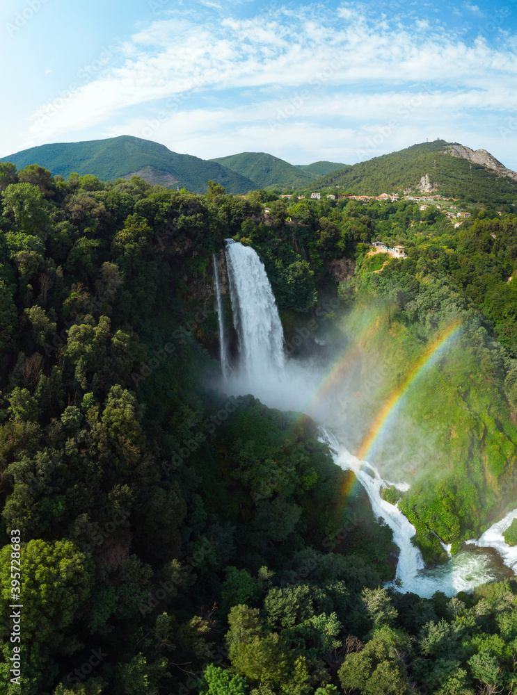 Aerial view. Water discharge, strong, maximum flow. Rainbow. The Cascata delle Marmore is a the largest man-made waterfall. Terni in Umbria Italy. Hydroelectric power plant. Vertical photo