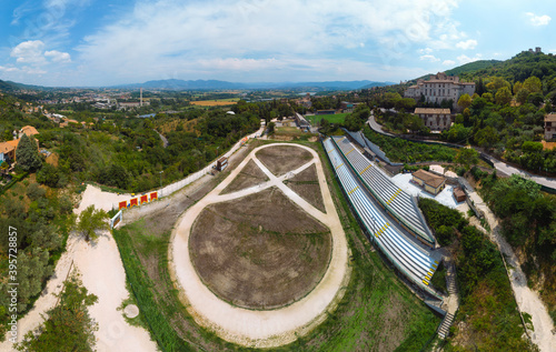 Panoramic aerial View of the city sports camp, football field and stands. Narni (Terni, Umbria, Italy). Incredible views. Summer day. Europe travel and vacation concept