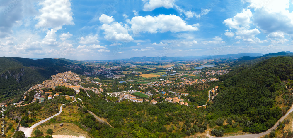 Panoramic aerial view from top of mountain of Narni (Terni, Umbria, Italy), medieval city with a rich history. Houses made of stone. Incredible views. Summer day. Europe travel and vacation concept