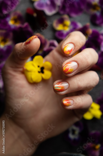 Hand of the girl with flowers