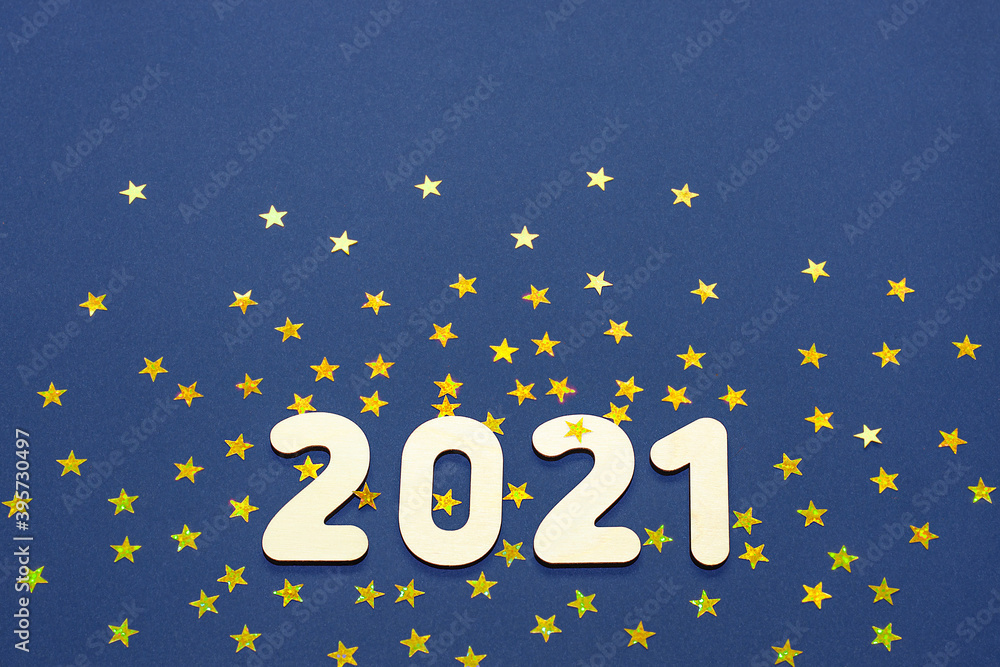 Merry Christmas and New year 2021 - Golden numbers on a classic blue background with sparkling stars. Copy space and flat lay. Space for text. Merry Christmas and New year 2021 - Golden numbers on a classic blue background with sparkling stars. Copy space and flat lay. Space for text.