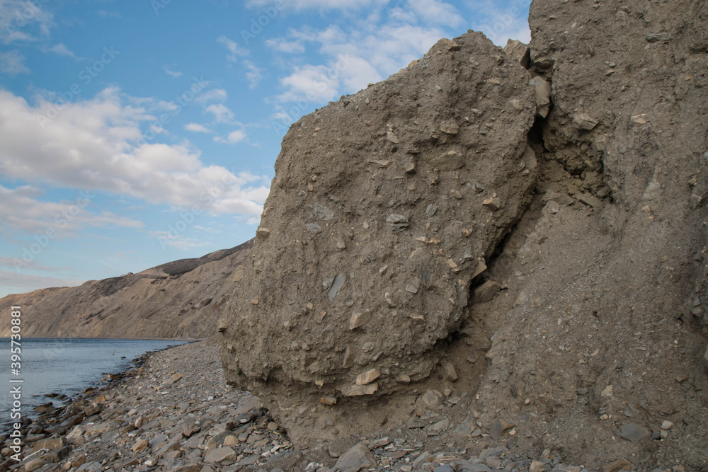 layered rocks and blue sky, black sea coast.
layered rocks and blue sky, black sea coast.