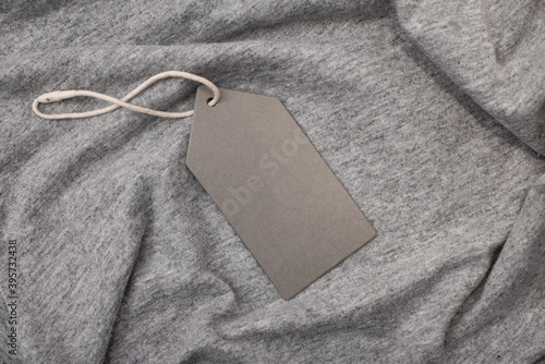 Gray tag on a rope on a gray t-shirt