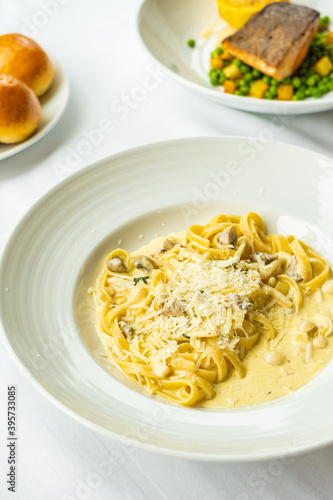 Yellow Spaghetti carbonara with white cream sauce in plate