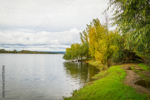 Riverside landscape view with autumn foliage
