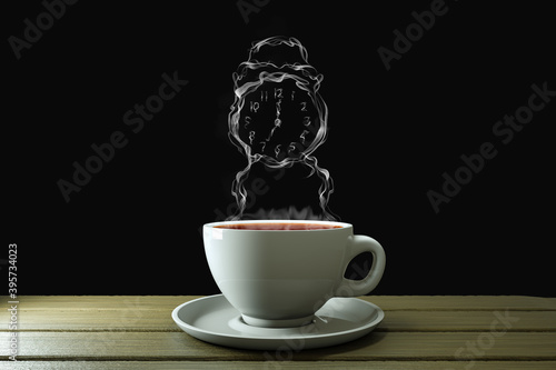 Fotografia Coffee cup with steam in alarm clock shape on wooden plank with black background