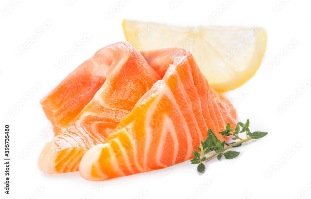 Fresh salmon sashimi slices and lemon Fresh salmon sashimi slices and lemon