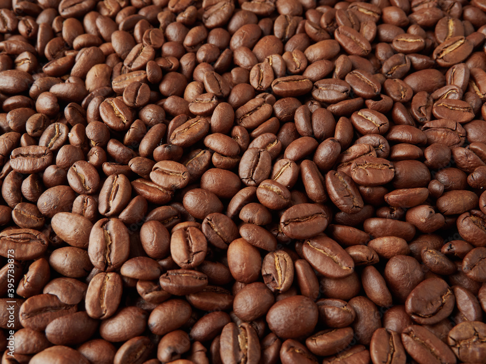 Coffee beans and hot coffee on the table Coffee beans and hot coffee on the table