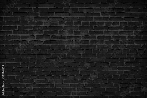 Black brick wall. Vintage dark background for creative design.