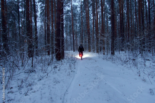 Extreme Sport race. Winter fatbiking challenge. Winter frosty night with snow. 