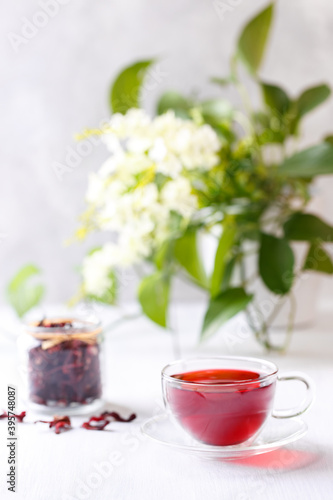 Healthy hibiscus tea in transparent cup