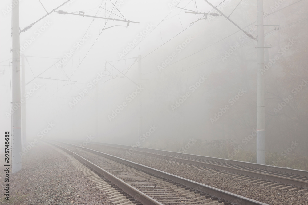 Railroad tracks stretching into the misty distance. The path into fog and uncertainty.