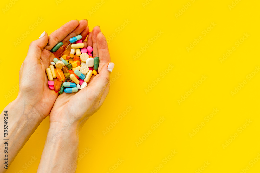 Medical capsule pills in hands top view