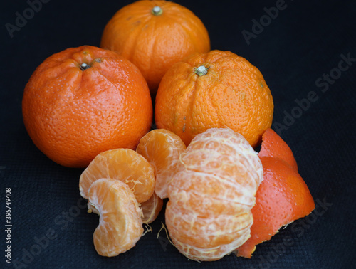 3 tangerines against black background  photo